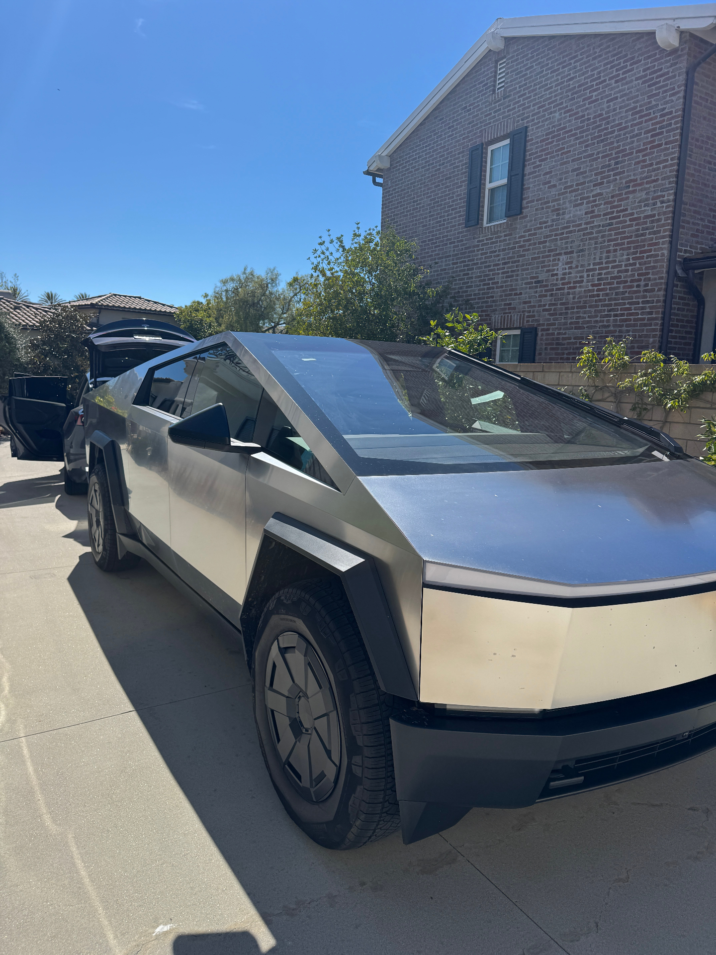 Tesla Cybertruck with aftermarket ceramic window tint, OEM glass comparison