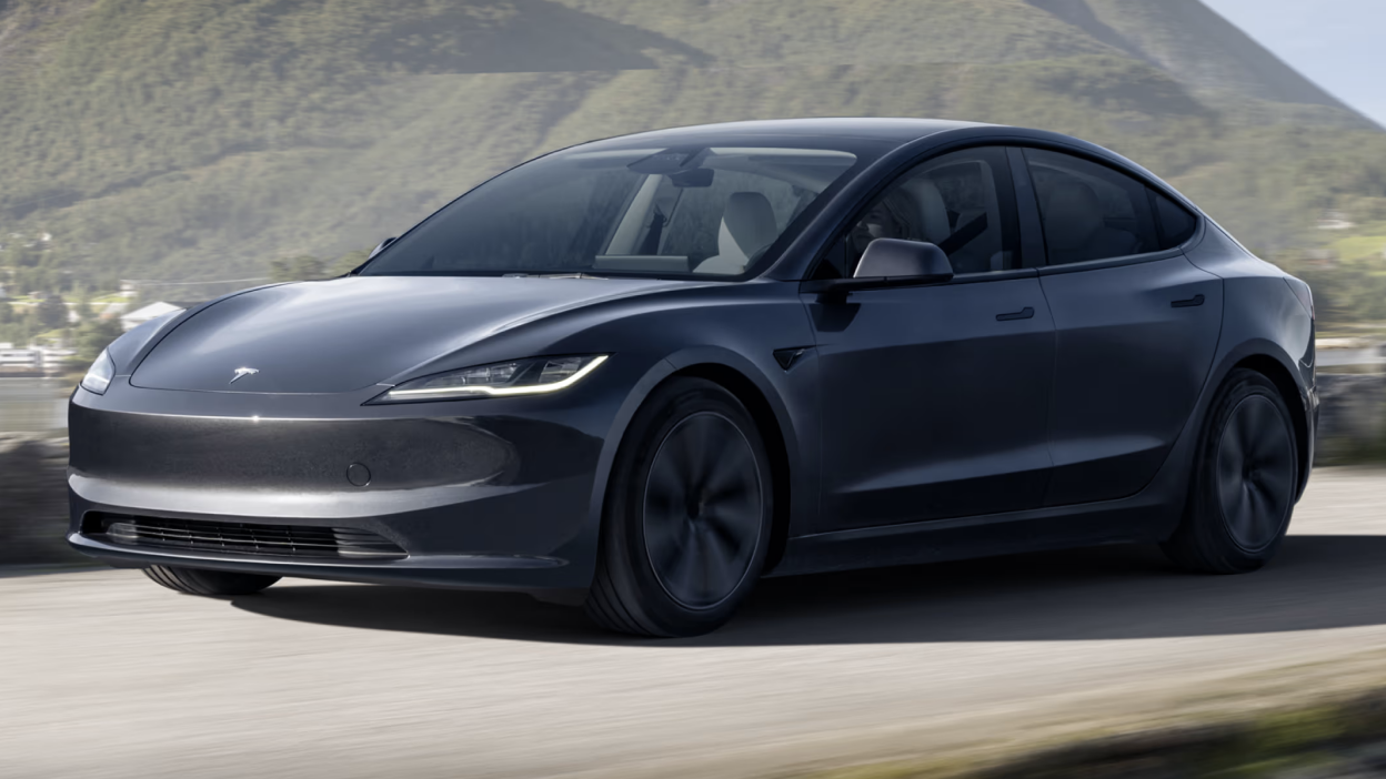 Tesla Model Y EV with dark ceramic window tint at San Diego charging station