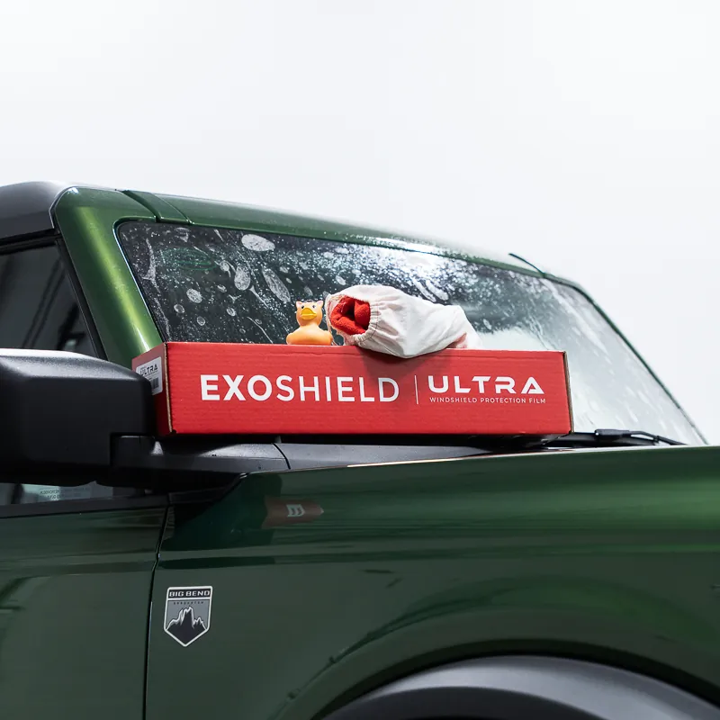 ExoShield ULTRA windshield protection film kit box on the hood of a Ford Bronco