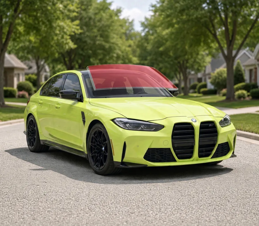 Yellow-green BMW M3 G80 sedan with ExoShield ULTRA windshield protection film shown over the windshield
