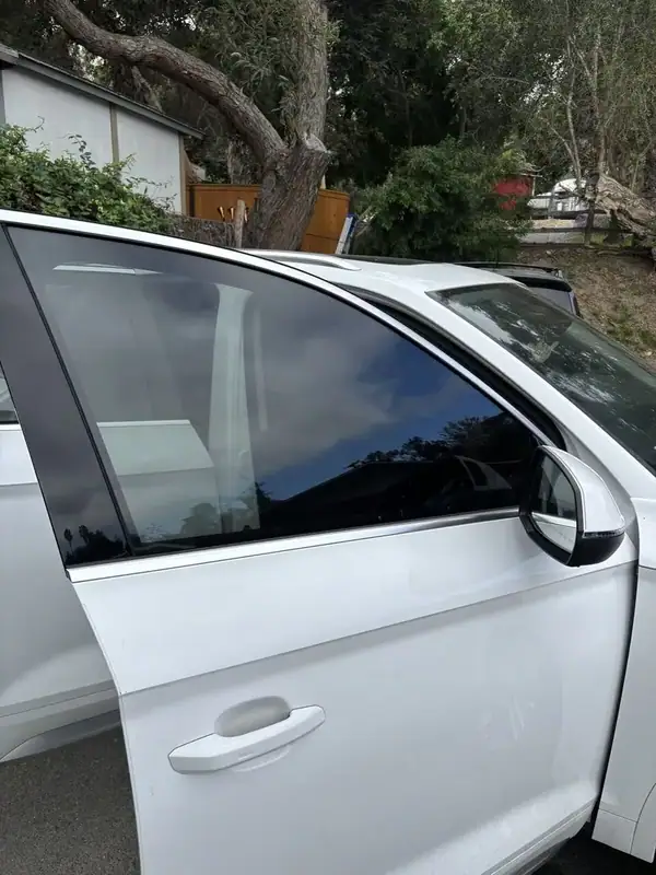 Audi Q5 passenger side with dark ceramic IR tint on side glass — mobile window tinting San Diego