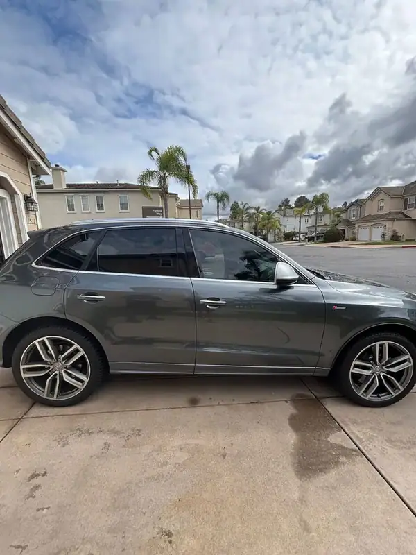 Daytona Gray 2015 Audi SQ5 Supercharged with HiTek ceramic window tint on two front doors installed by BestAutoTechs mobile window tinting in San Diego