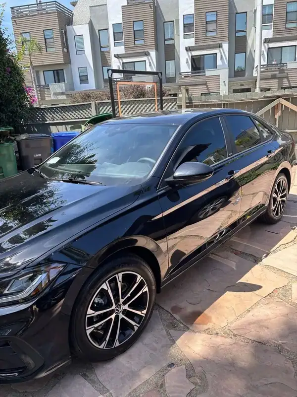 Black Volkswagen Jetta with ceramic window tint installed by BestAutoTechs mobile window tinting in Carlsbad, San Diego County
