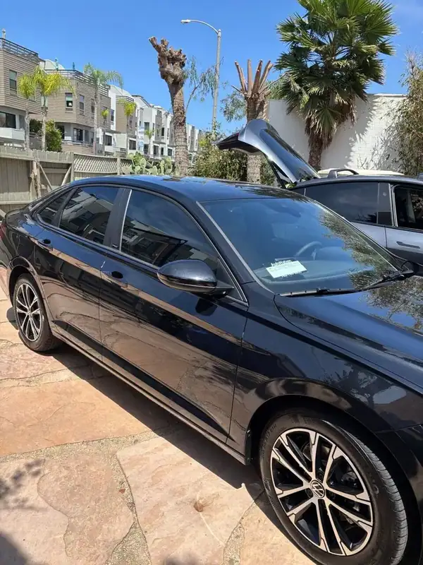 Black VW Jetta side profile after ceramic window tint install in Carlsbad by BestAutoTechs mobile service