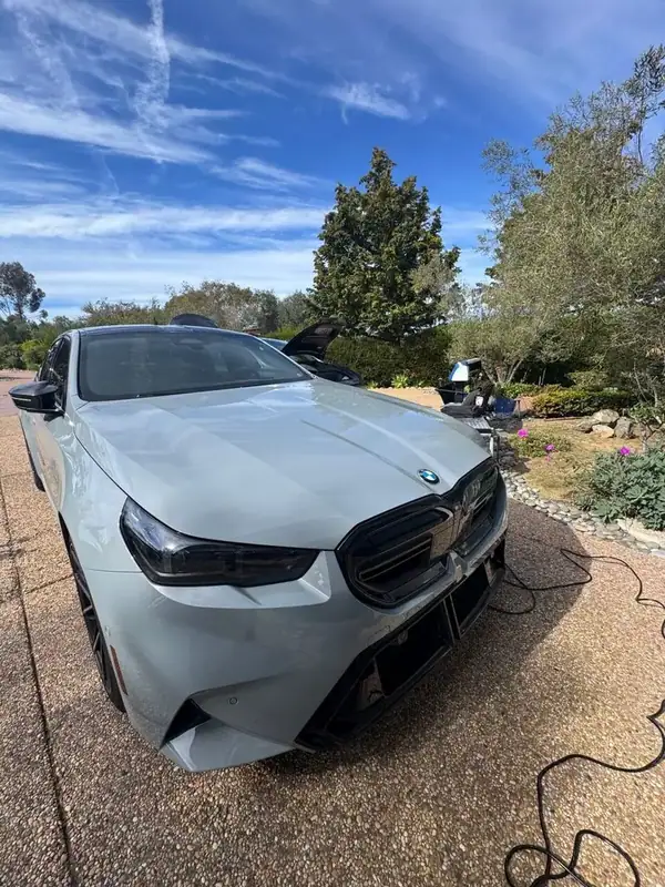 BMW M5 front angle showing ceramic tint installation — San Diego mobile window tinting