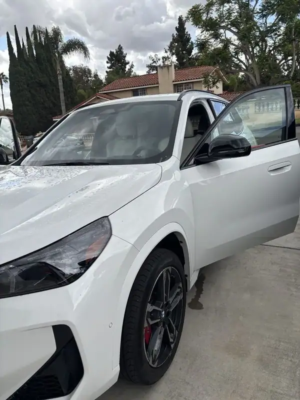 BMW X1 M-Sport driver-side close-up after ceramic IR film install on front door window — mobile window tint San Diego