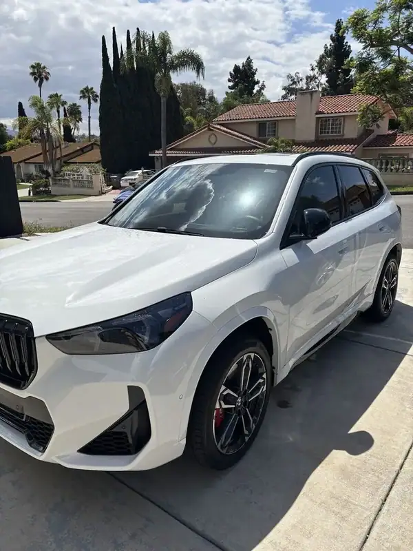Alpine White BMW X1 M-Sport with front 2 windows ceramic tint installed by BestAutoTechs mobile window tinting in San Diego