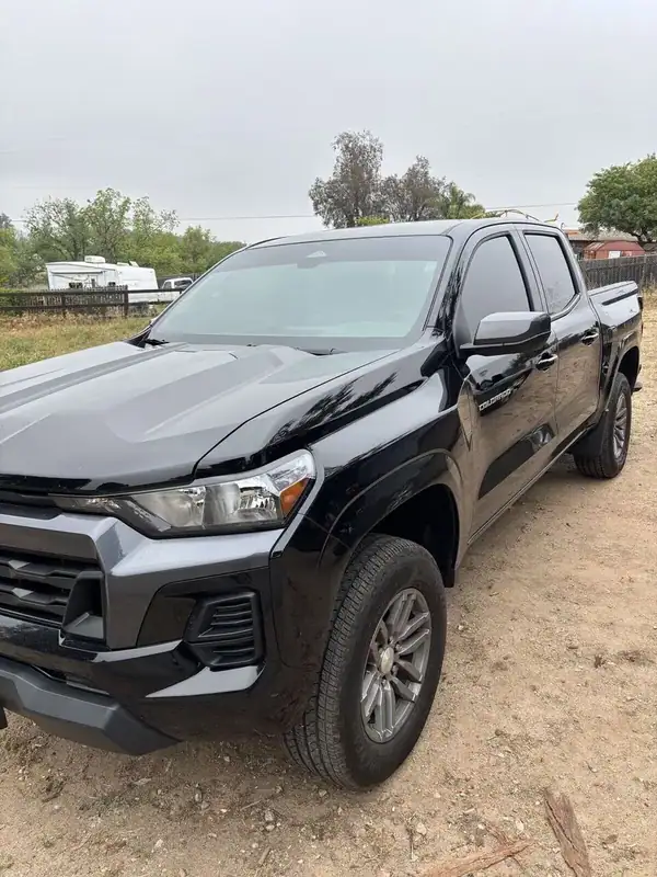 Black 2026 Chevrolet Colorado LT Crew Cab front three-quarter view after full vehicle ceramic IR window tint install — mobile window tinting San Diego