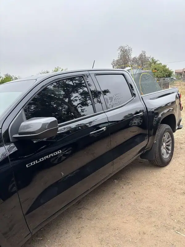 2026 Chevy Colorado driver-side profile after full ceramic window tint install showing matched front and rear door tint and COLORADO badge — BestAutoTechs San Diego mobile
