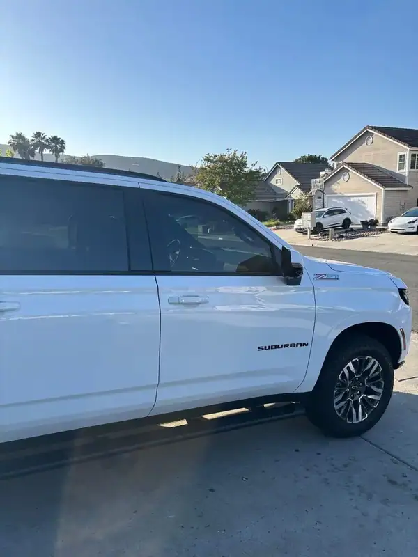 2025 Chevy Suburban Z71 passenger-side profile after full HiTek ceramic window tint install — uniform shade front to back, BestAutoTechs San Diego mobile