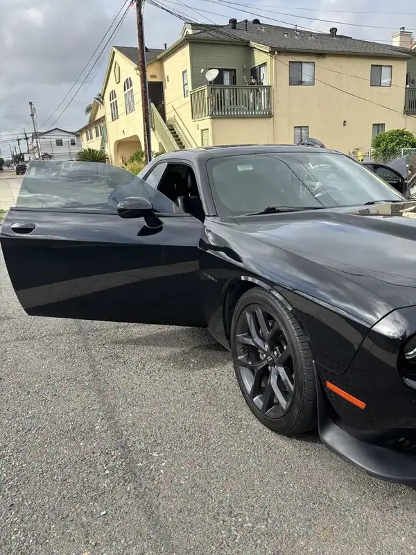 Black Dodge Challenger R/T HEMI muscle coupe with ceramic window tint installed by BestAutoTechs mobile window tinting in San Diego