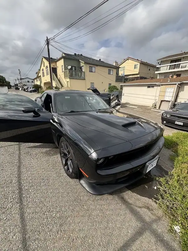 Black Dodge Challenger R/T HEMI front three-quarter view with completed HiTek ceramic IR window tint — mobile window tinting San Diego