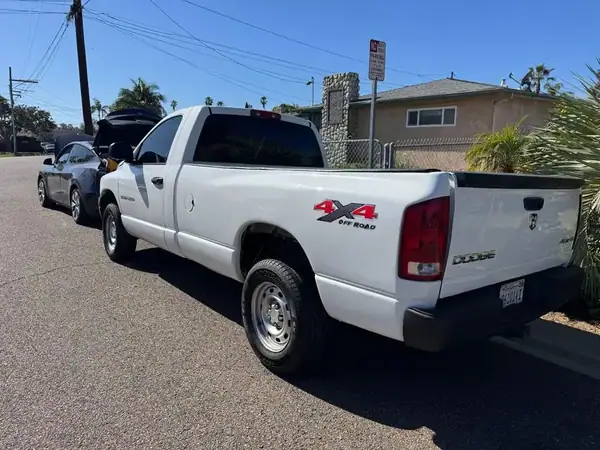 Dodge Ram 1500 rear view with carbon tint on back glass and 4x4 Off Road badge — San Diego mobile service