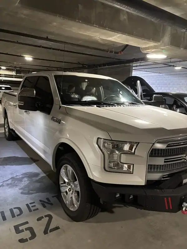 Ford F-150 Platinum passenger side with dark ceramic IR tint on cab glass — mobile window tinting San Diego
