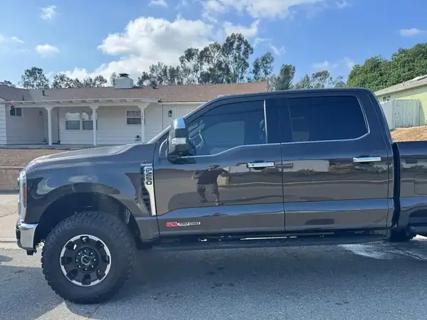Ford F-250 King Ranch Tremor side view showing ceramic window tint — mobile tinting San Diego