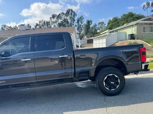 Ford F-250 Tremor rear view with dark ceramic window tint — San Diego mobile window tinting