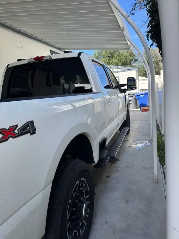 Ford F-250 Platinum rear view with dark ceramic tint on back glass and 4x4 badge — BestAutoTechs San Diego