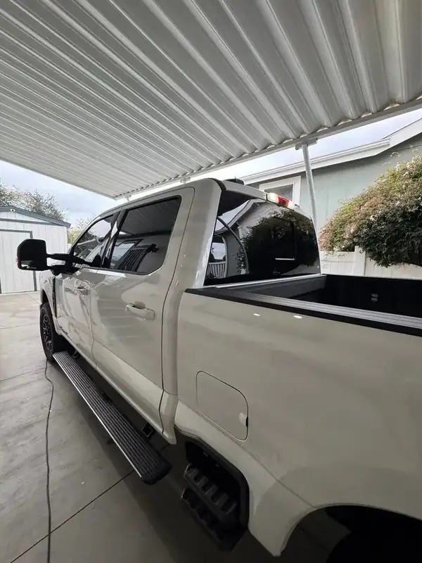 Ford F-250 Platinum side profile with ceramic tint on all windows — San Diego mobile service