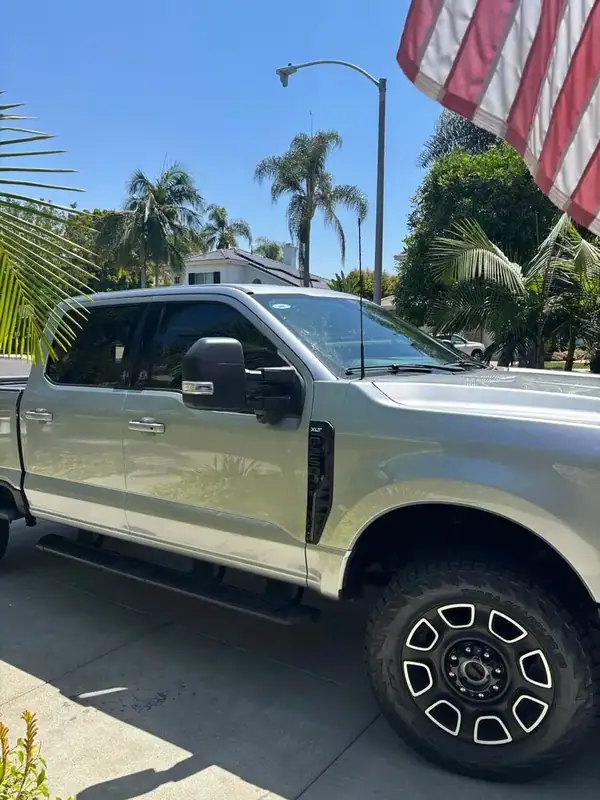 Ford F-250 Super Duty XLT passenger side with American flag — ceramic window tint Rancho Bernardo