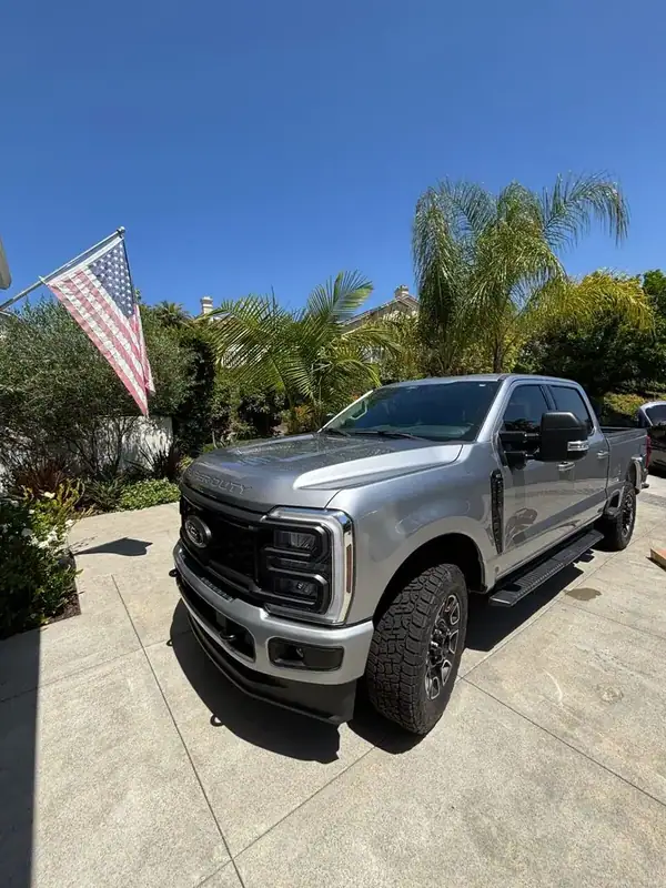Ford F-250 Super Duty XLT front view in driveway after mobile ceramic window tint install — San Diego