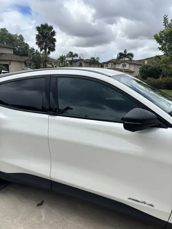 Ford Mustang Mach-E rear quarter glass with dark ceramic IR tint — mobile window tinting San Diego