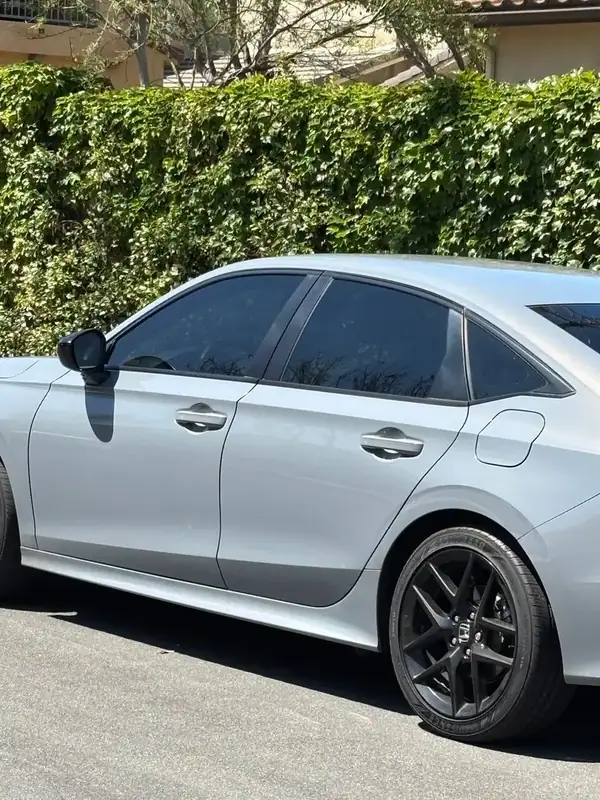 2025 Honda Civic Sport driver-side rear profile after full HiTek carbon window tint install — color-matched front to back, BestAutoTechs San Diego mobile