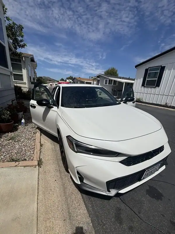 White Honda Civic in driveway with both front doors open during 70% ceramic IR window tint installation — BestAutoTechs mobile San Diego