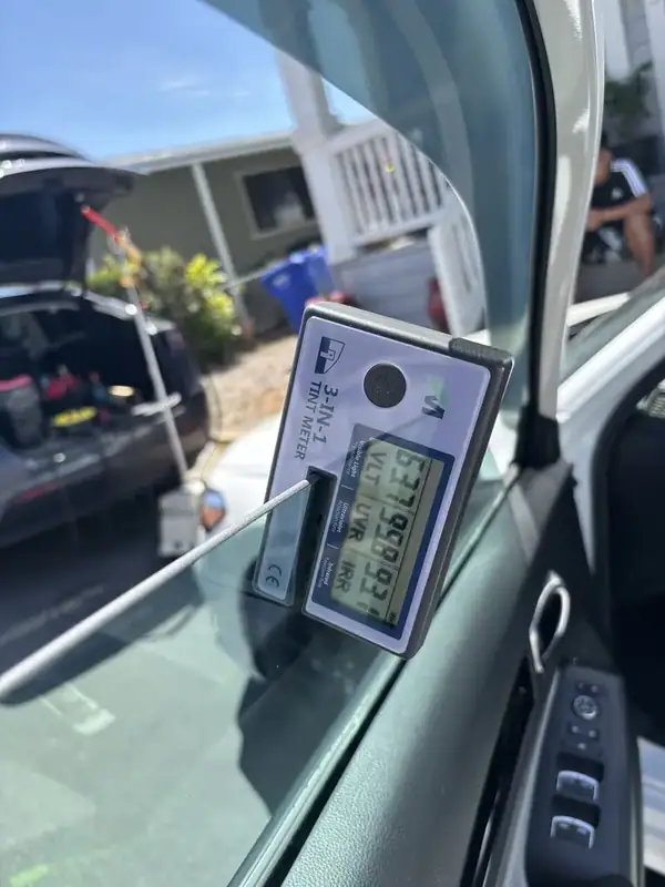 Honda Civic passenger-side front window with freshly installed 70% HiTek ceramic IR film — clear visibility, max heat rejection