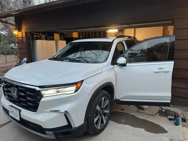 Honda Pilot front three-quarter view with ceramic window tint on front windows — San Diego mobile service