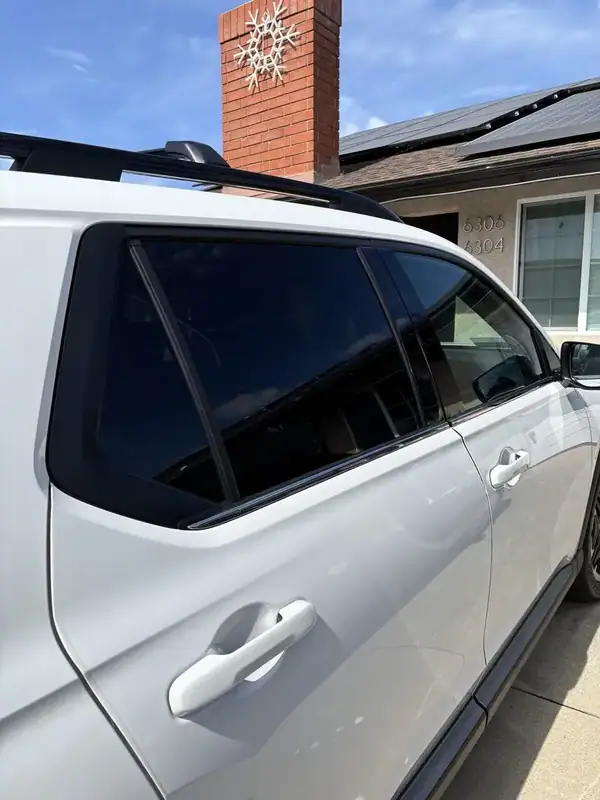 2026 Honda Pilot passenger-side rear door and quarter window close-up after HiTek ceramic IR window tint install — mobile window tinting San Diego