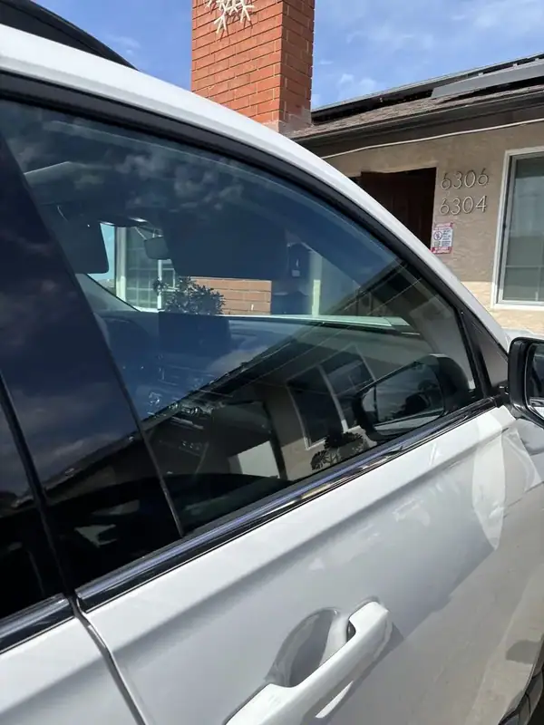 2026 Honda Pilot front passenger window showing optical clarity of HiTek ceramic IR film with no purple haze — BestAutoTechs mobile window tinting San Diego