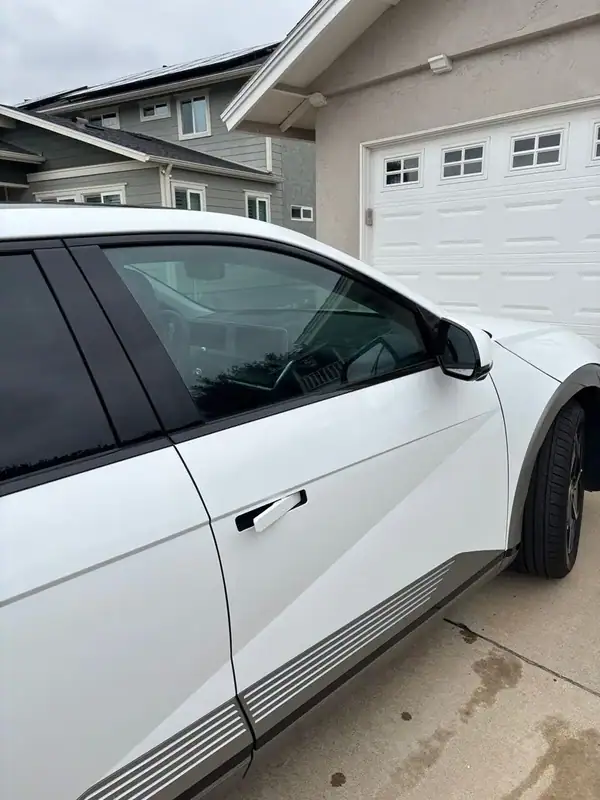 Atlas White Hyundai Ioniq 5 after 70% HiTek Ceramic windshield and front two-window tint install by BestAutoTechs mobile window tinting in San Diego