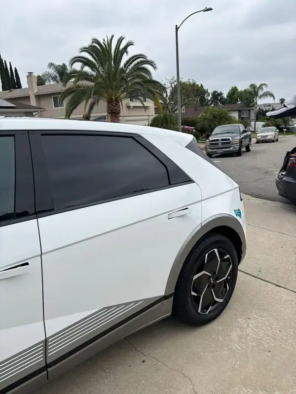 Hyundai Ioniq 5 rear three-quarter view with dark factory privacy rear glass and matched front tint — BestAutoTechs San Diego mobile
