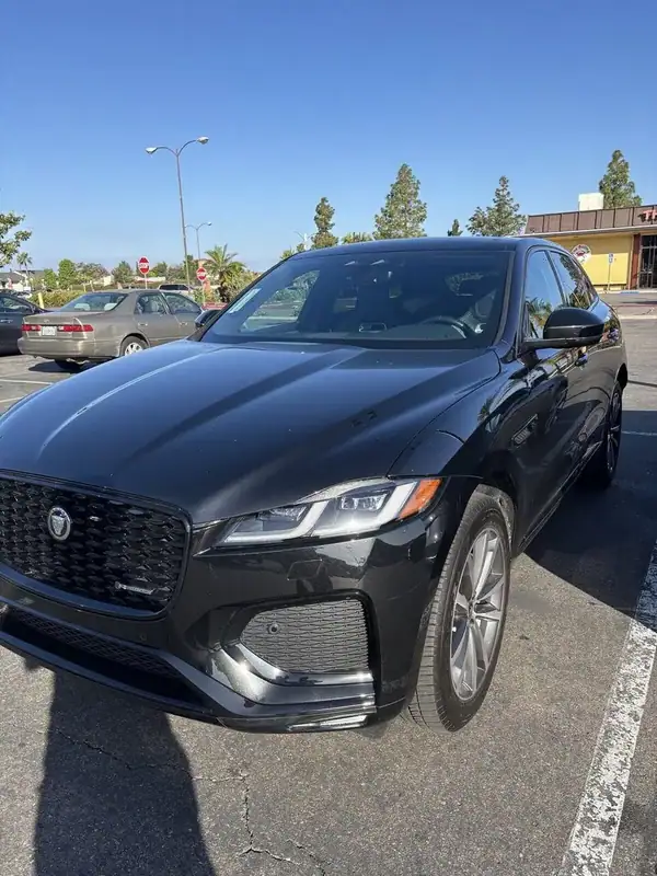 Jaguar F-Pace R-Dynamic front three-quarter view showing finished 70% ceramic IR front-window tint paired with darker factory rear glass — mobile window tinting San Diego