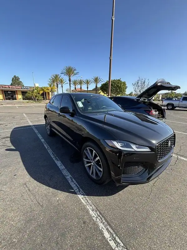 Santorini Black Jaguar F-Pace R-Dynamic with front 2 windows ceramic IR tint installed by BestAutoTechs mobile window tinting in San Diego