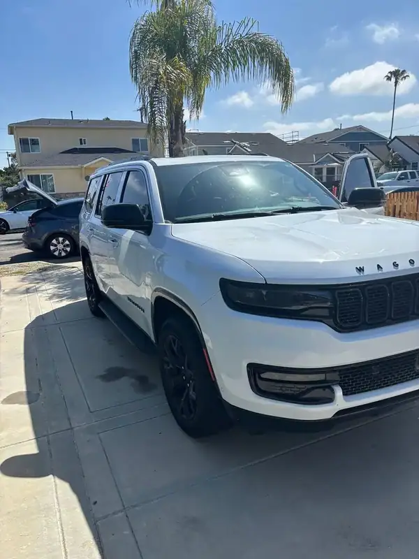 Bright White Jeep Wagoneer with full HiTek ceramic IR window tint installed by BestAutoTechs mobile window tinting in San Diego