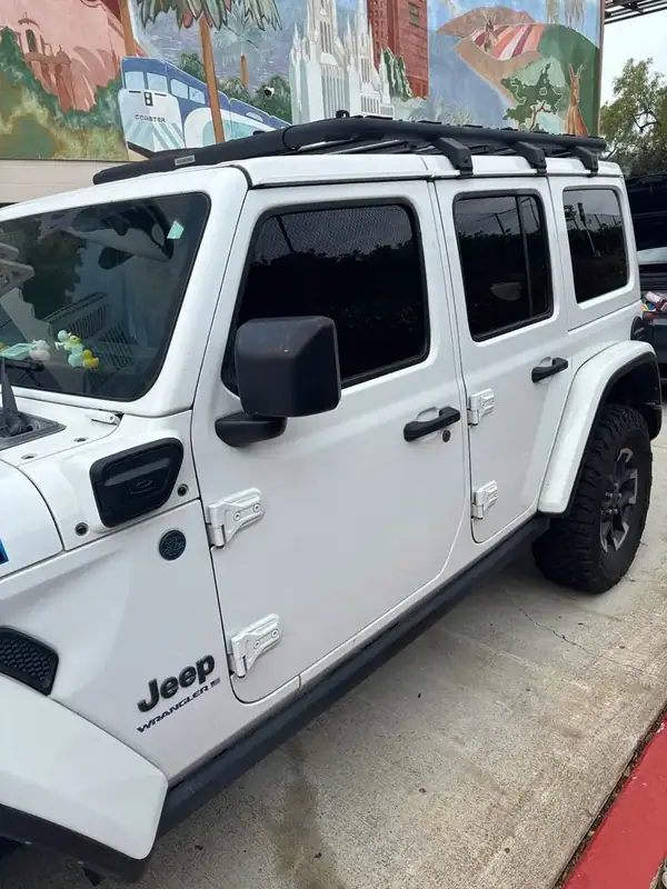 Jeep Wrangler Unlimited Rubicon driver-side profile showing color-matched HiTek Ceramic tint on front and rear doors — BestAutoTechs San Diego mobile