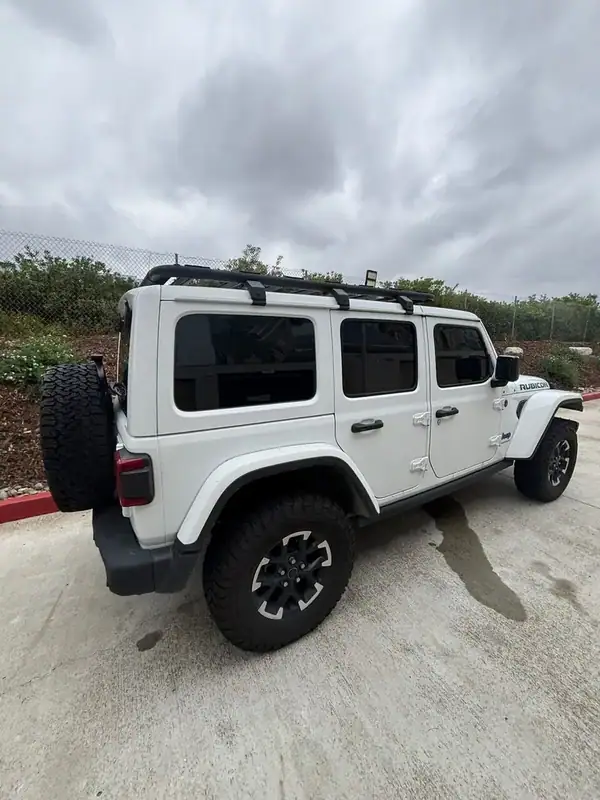 Jeep Wrangler Unlimited Rubicon rear three-quarter view after full HiTek Ceramic IR window tint install on rear doors, quarter glass, and rear hatch — BestAutoTechs San Diego mobile