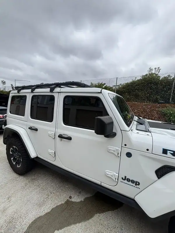 Jeep Wrangler Unlimited Rubicon passenger-side profile after full HiTek Ceramic max heat rejection window tint install — uniform shade front to back, BestAutoTechs San Diego mobile