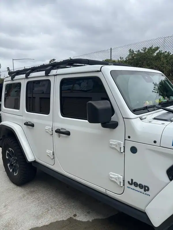Jeep Wrangler Unlimited Rubicon driver-side close-up showing matched HiTek Ceramic tint on front and rear doors against Bright White paint — BestAutoTechs San Diego mobile