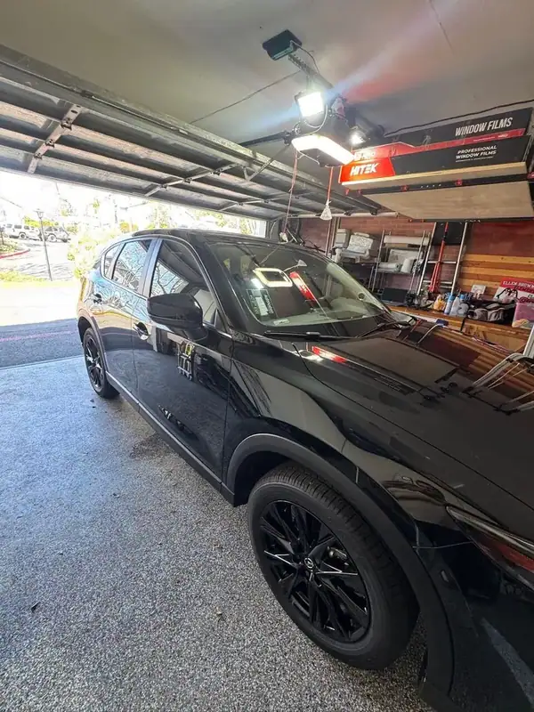 Mazda CX-5 front angle in shop with completed ceramic IR window tint — mobile window tinting San Diego