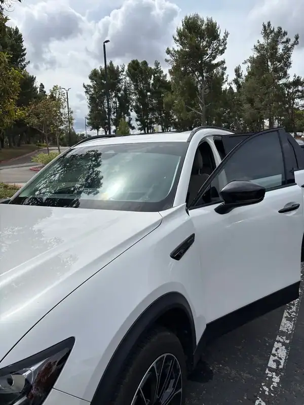 Mazda CX-70 PHEV front passenger door open after full HiTek ceramic window tint install — clean factory-style finish on door glass and quarter, BestAutoTechs San Diego mobile
