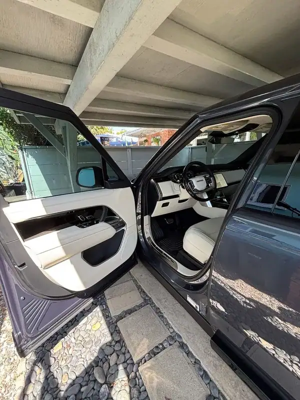 2026 Range Rover Perlino cream interior with cabin shaded by HiTek ceramic IR window tint — San Diego mobile install