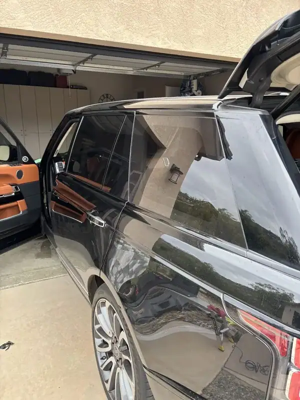 Land Rover Range Rover Autobiography passenger side with dark ceramic IR tint — mobile window tinting San Diego