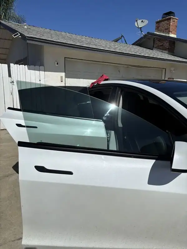 2021 Tesla Model 3 passenger-side rear door view with deep ceramic tint and factory-style window deflectors — BestAutoTechs Ramona