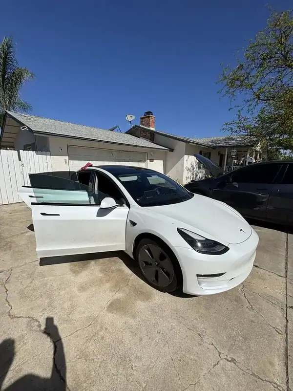 2021 Tesla Model 3 rear hatch and quarter glass close-up showing matched ceramic IR tint — mobile window tinting Ramona