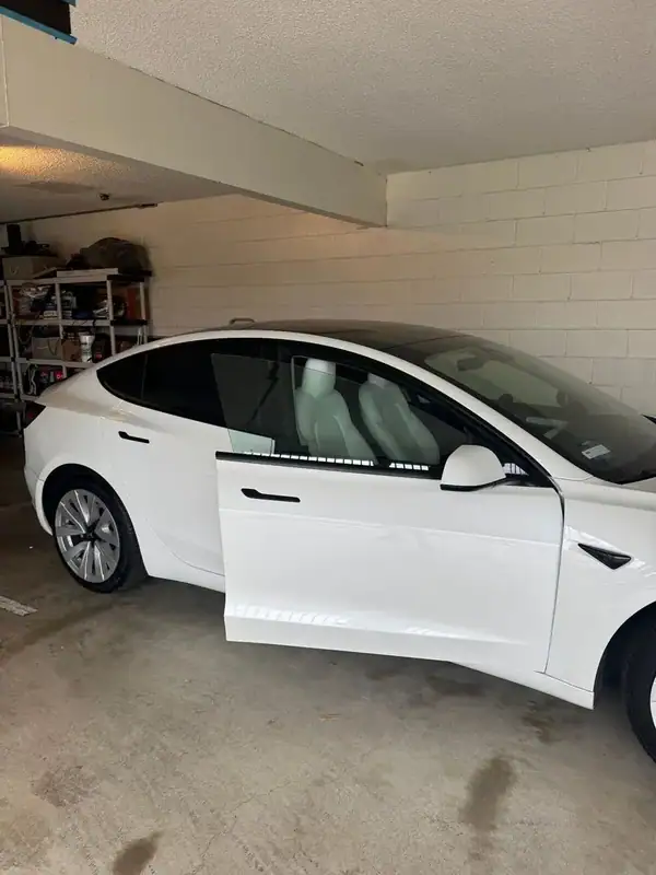Tesla Model 3 side profile with door open showing ceramic window tint — San Diego mobile service