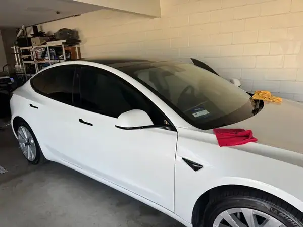 Tesla Model 3 with full ceramic window tint on sides back roof and windshield installed by BestAutoTechs mobile window tinting in San Diego