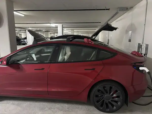 Red Tesla Model 3 Performance with full vehicle ceramic window tint including roof and windshield by BestAutoTechs mobile window tinting in San Diego