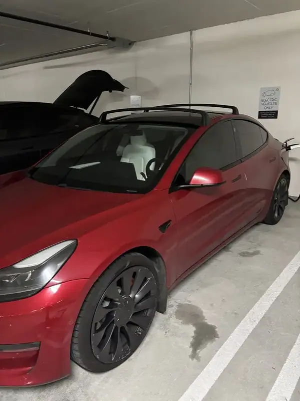 Tesla Model 3 Performance front three-quarter with tinted windshield and panoramic glass roof — San Diego mobile EV tint